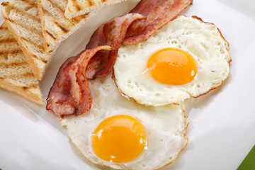 Breakfast - toasts, eggs, bacon