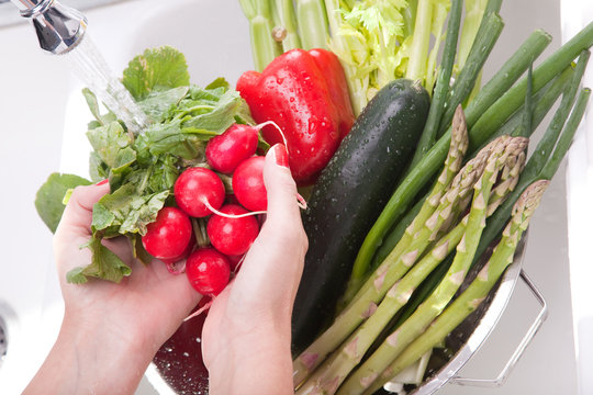 Hands Rinsing Vegetables