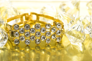golden bracelet with many diamonds