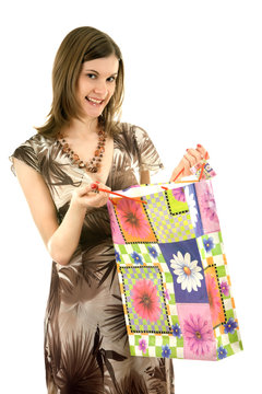 Young woman with shopping bags; isolated on white