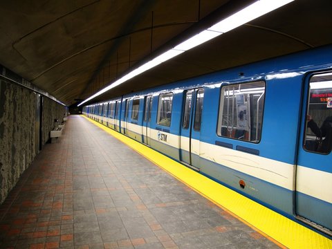 A subway leaving a station