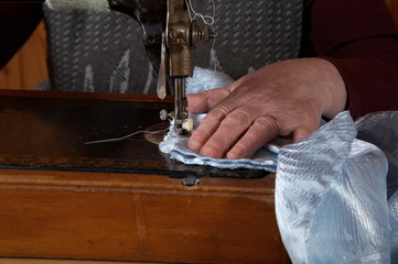 The old woman sews