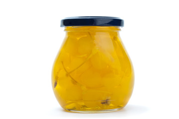 Glass jar with yellow cocktail cherries