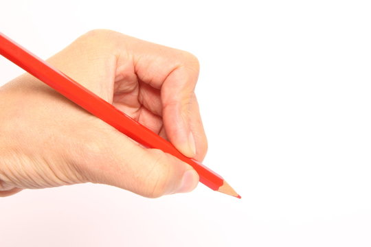 hand holding pencils