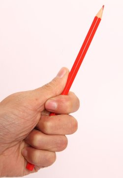hand holding pencils