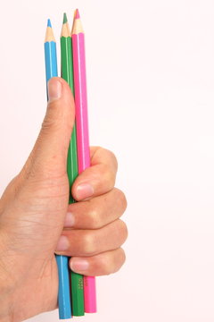 hand holding pencils