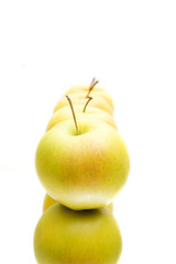 lots of yellow apples isolated on white