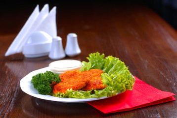 a plate of tasty chops served with sauce