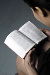 Fototapeta premium Asian lady reading chinese bible