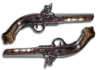 Old flintlock pistols isolated on white background