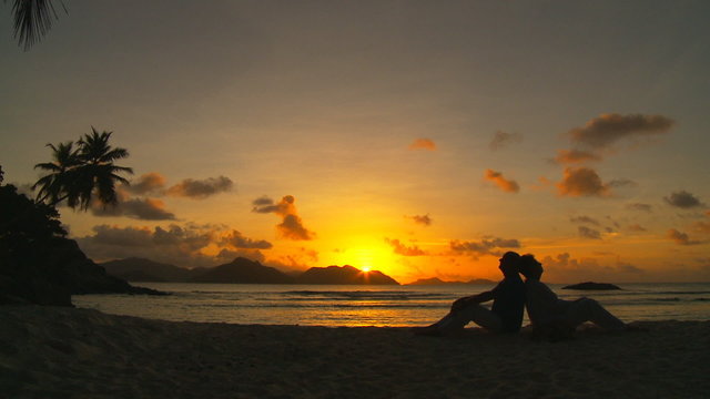 couple on beach at sunset