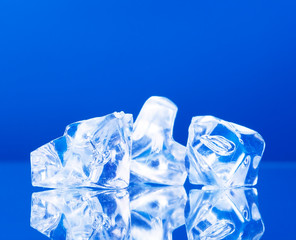 close-up of ice cubes on blue