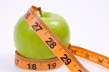 apple wrapped in measuring tape