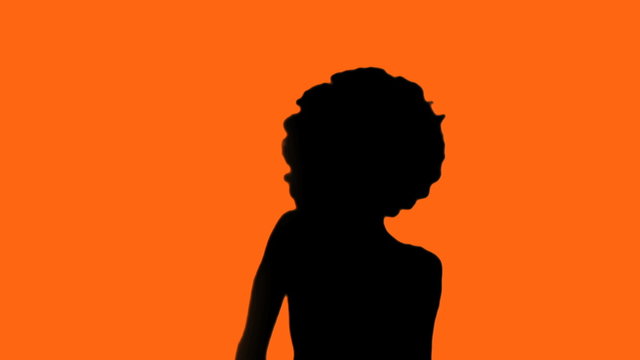 Afro chick against orange background martial arts - HD