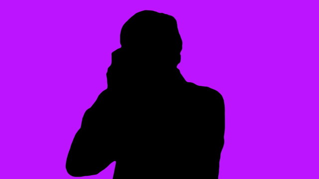 Photographer silhouette against purple - HD