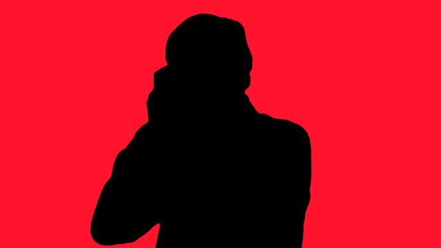 Photographer silhouette against red - HD