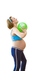 Young pregnant woman with green ball