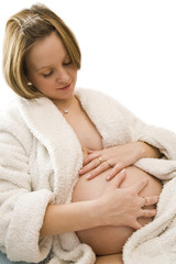 Obraz na płótnie Canvas pregnant woman holding her belly