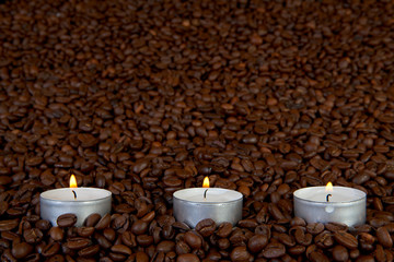 Candles in coffee beans
