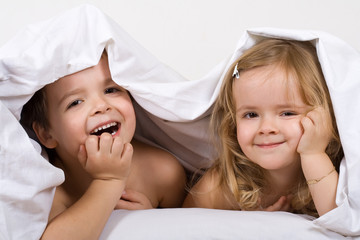 Kids having fun in the bed