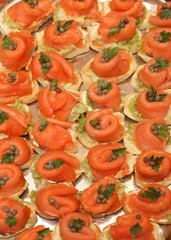 Smoked salmon, capers and parsley on toasted bread with butter