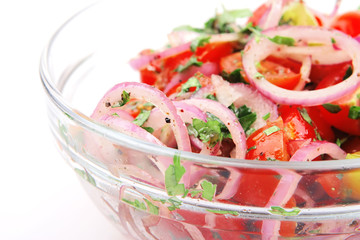 fresh tomato salad inside transparent bowl