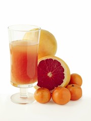 grapefruits and juice in a glass