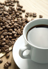 Coffee cup and grain background