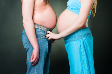Humorous photo of pregnant woman and fat man
