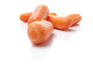 Baby carrots on white