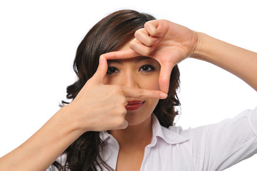 Fototapeta premium A pretty young asian woman with framing hands