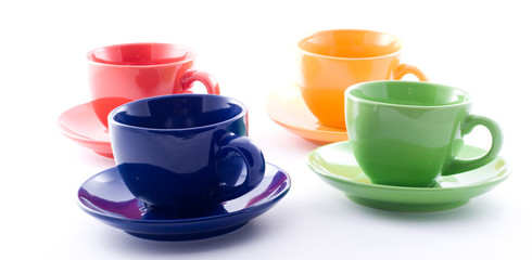 Obraz na płótnie Canvas Four colourful cups isolated on white