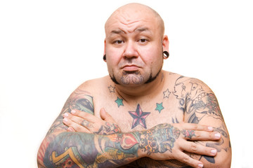 portrait of a bald man with tattoos