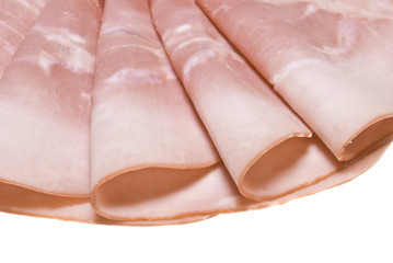 Slices of tasty ham on white dish. Shallow depth of field