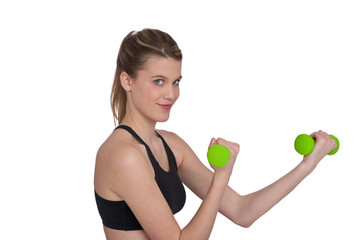 Smiling woman exercising with green weights