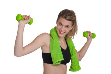 Beautiful woman exercising with green weights