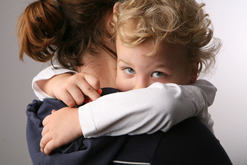 Mother holds son.