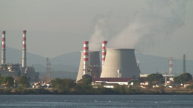 Nuclear power plant, cooling towers emitting steam