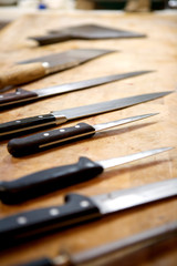 knives in a butchery on a part of wood