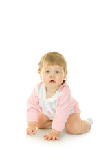 Sitting small girl in pink dress