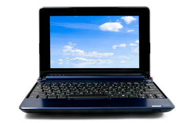 laptop computer with blue cloudy sky wallpaper