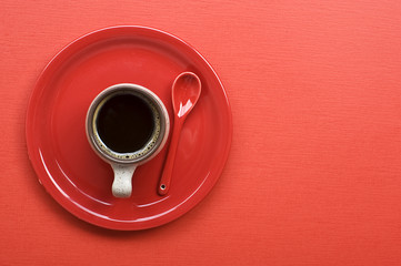 Coffee cup on red table