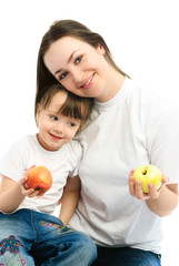 Fototapeta premium mother and daughter eating apples