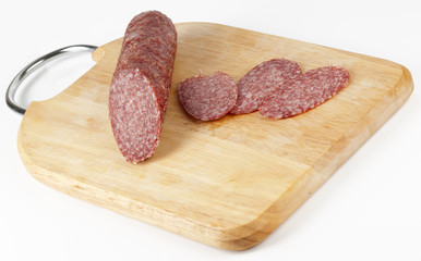 Hot salami on chopping plank