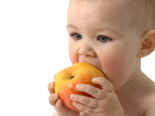 Beautiful child eats red apple