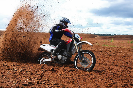 Fototapeta Off-road motorbike driving in dirt.