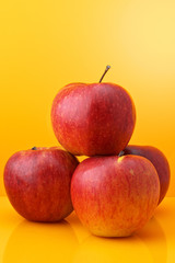 Apples on yellow