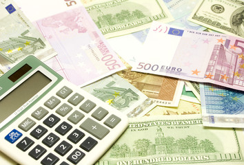 Dollar, euro, lat banknotes, calculator