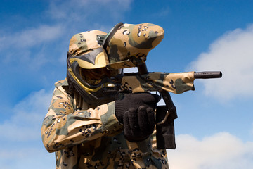 Fototapeta premium Paintball player with gun