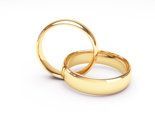 Wedding golden rings one over another. Isolated